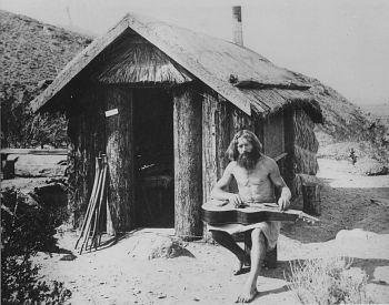 Bill Pester at this palm log cabin in Palm Canyon, California, 1917. With his "lebensreform" philosophy, nudism and raw foods diet, he was one of the many German immigrants, who "invented" the hippie lifestyle more than half a century before the 1960s. He left Germany to avoid military service in 1906 at age 19, for a new life in America. (Photo Courtesy of Collection Palm Springs Desert Museum, Palm Springs, California)