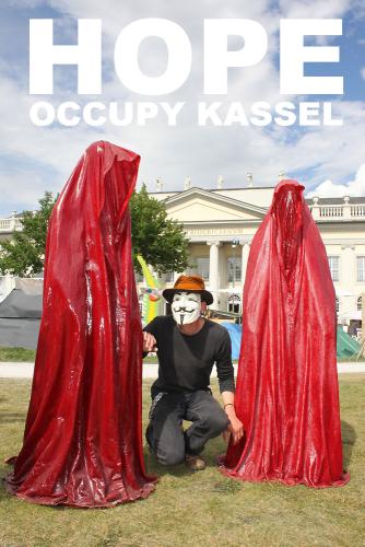 occupy-kassel-arts-documenta-show-guerilla-anonymous-mask-hope-time-guards-sculpture-manfred-kielnhofer