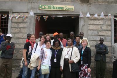 UNEP interns, volunteers and staff members at the entrance to the new school building