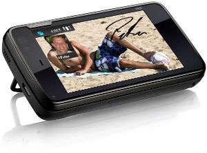 N900 mit Mann am Strand als Hintergrundfoto